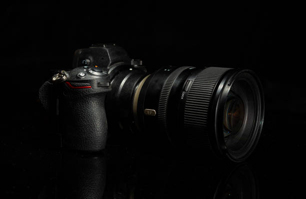istock Digital mirrorless camera isolated on dark black banner 1795391830