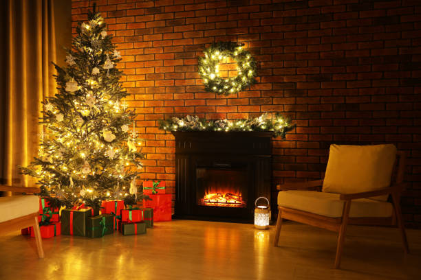 istock Beautifully wrapped gift boxes under Christmas tree in living room 1795392937