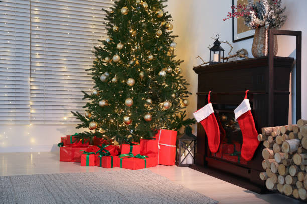 istock Beautifully wrapped gift boxes under Christmas tree in living room 1795393478