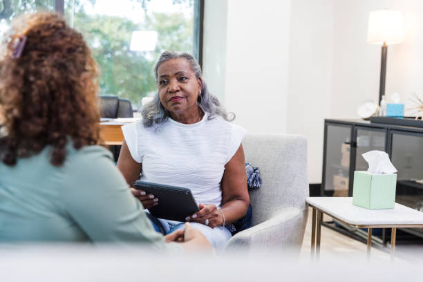 istock Unrecognizable female patient talks with her therapist 1795395178