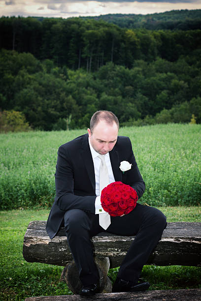 istock Lonely groom with wedding bouquet 179539857