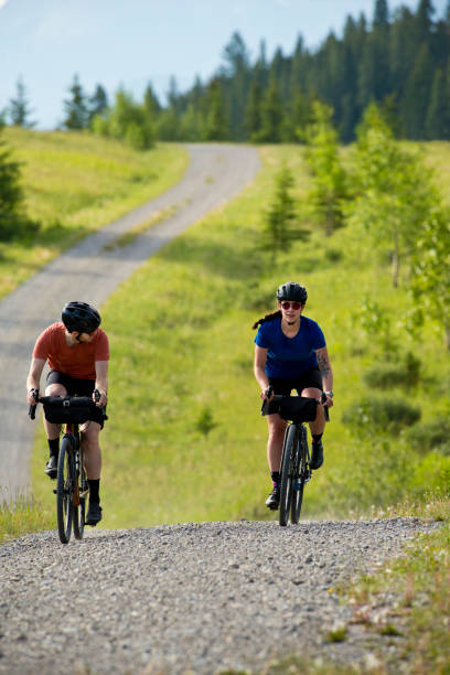istock Gravel Road Biking Couple 1795400583