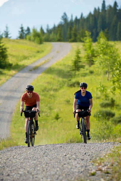 istock Gravel Road Biking Couple 1795401108