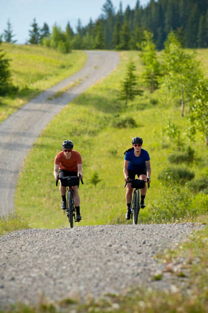 istock Gravel Road Biking Couple 1795401129