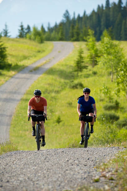 istock Gravel Road Biking Couple 1795401131