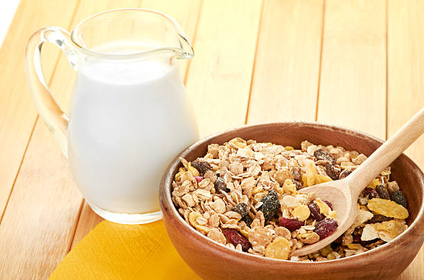 istock Plate with raw oatmeal on wooden table. 179540116