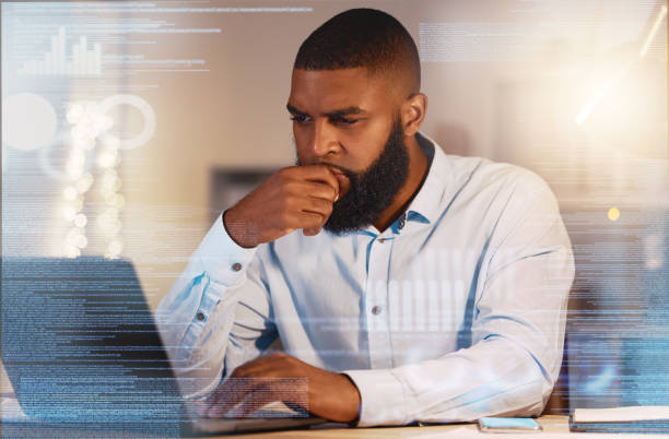 istock Thinking, finance hologram and black man on laptop working on stock trading, data analytics and research. Digital overlay, business and male worker with ideas, brainstorming and strategy on computer 1795401293