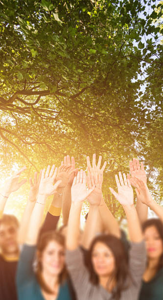 istock Volunteer arm raised on the park 179540136