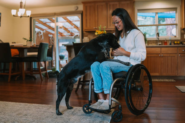 istock Woman with physical disability spends time with pet dog 1795402714