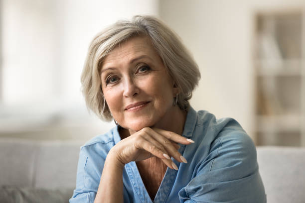 istock Positive pretty elder senior woman looking at camera 1795404348