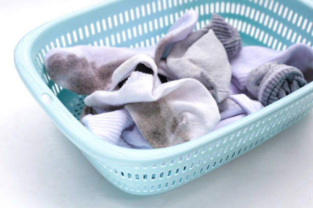 istock Dirty white socks in laundry basket 1795417594