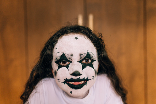 Portrait of a little girl with makeup for Halloween