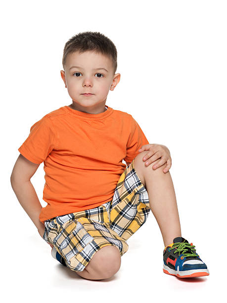 istock Serious little boy in the orange shirt 179546007