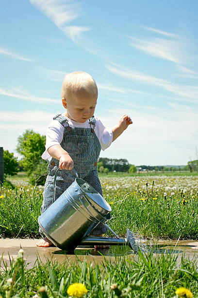 istock Baby Boy with Watering Can 179546495