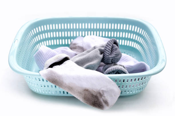 istock Dirty white socks in laundry basket 1795465429
