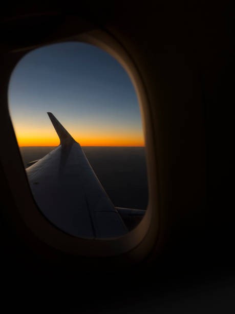 istock Airplane window view of dawn 1795483211