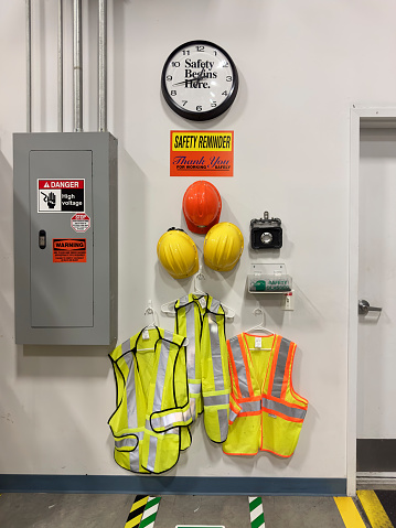 Safety equipment hanging on a wall of a warehouse