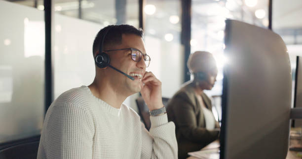 istock Computer, smile  and man with telemarketing, customer service and connection with conversation. Business, consultant and employee with a pc, tech support and help desk for life insurance and advice 1795489637