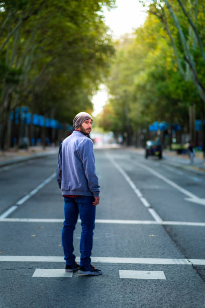 autumn flair in madrid: bearded street-smart cowboy. - autumn street single lane road tree imagens e fotografias de stock