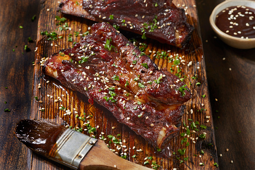 Korean Style Sticky Beef Ribs with Sesame Seeds and fresh Parsley