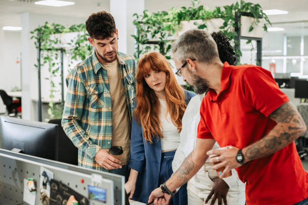 istock Redhead woman team leader discussing and planning projects during a meeting 1795508907