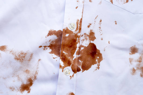 istock Dirty choclate stain on white shirt 1795512676