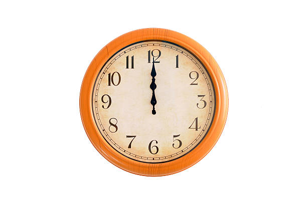 istock Isolated clock showing 12 o'clock on a white wall 179553791