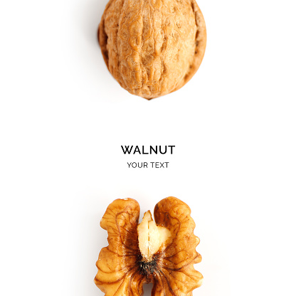 Creative layout made of walnut on the white background. Flat lay. Food concept.
