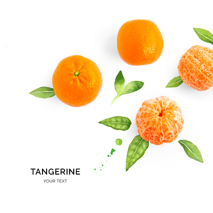 Creative layout made of tangerine on the watercolor background. Flat lay. Food concept.