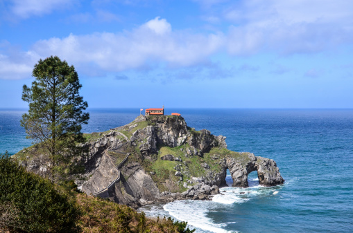 Panoramic view of the hermitage of San Juan de Gaztelugatxe located on tiny islet on the coast of Biscay in Basque Country (Spain)
