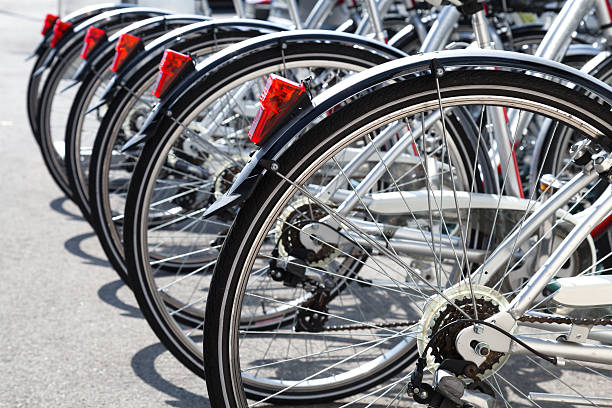istock Bicycles for rent stand in a row on parking 179555587