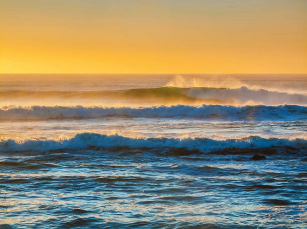 istock Treacherous incoming surf backlit by a golden sky 1795579585