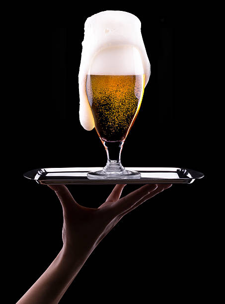 istock Frosty glass of light beer on black background 179559302
