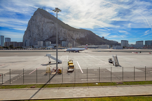 British Airways Airbus A320-232 on the runway at Gibraltar Airport, with the Rock of Gibraltar behind.