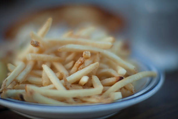 French fries on a dinner plate stock photo