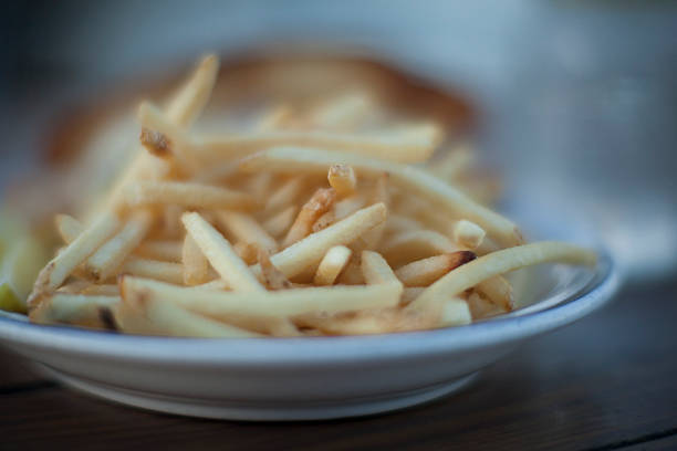 French fries on a dinner plate stock photo
