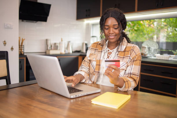 istock Happy young customer enjoys shopping online 1795678701