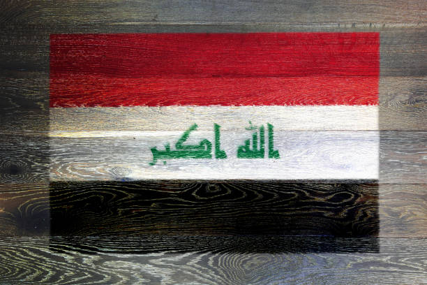 istock Iraq flag on rustic old wood surface background 1795695876