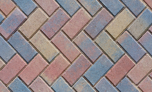 Herringbone brick pavers pattern - Seamless file that can be tiled together for a larger image, 3D texture, rendering or for use as wall, patio or outdoor flooring or walkways. Shot in early morning light.