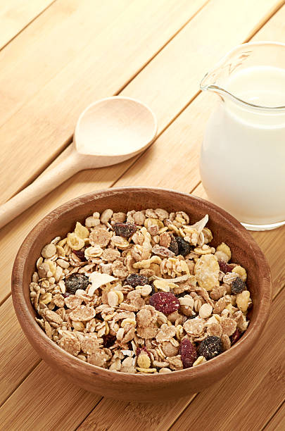 istock Plate with raw oatmeal on wooden table. 179573033