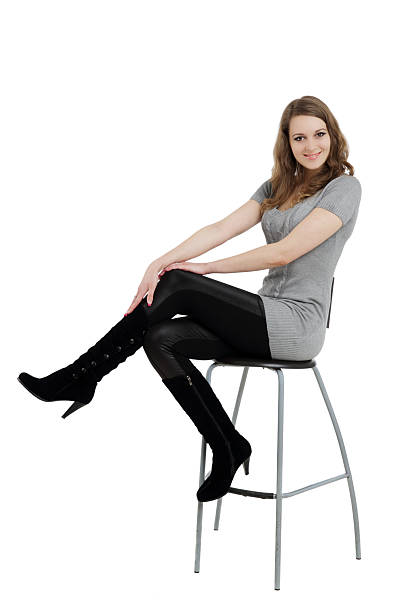 istock Smiling woman sitting on chair 179573590