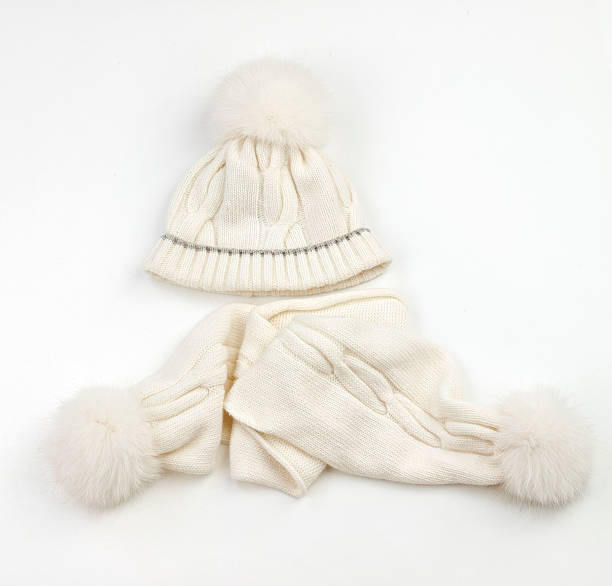 istock White warm woolen knitted winter hat and scarf 179575230
