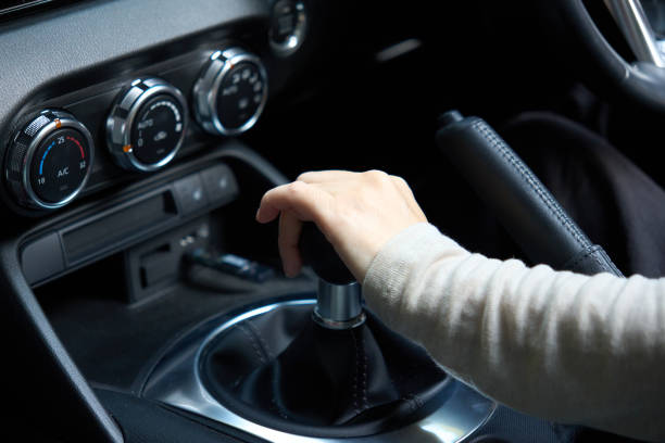 istock Woman's hand operating manual transmission 1795765865