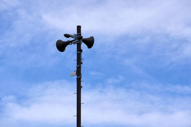 Tsunami warning speaker towering against the blue sky