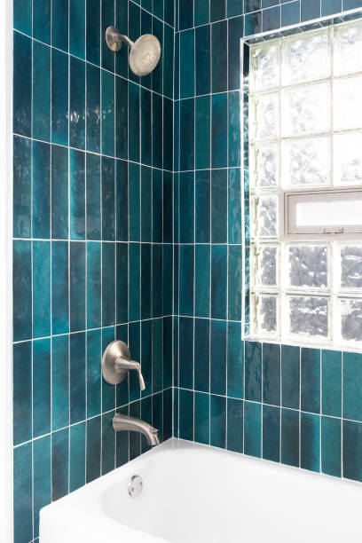 istock A shower detail with vertical blue subway tiles. 1795772212