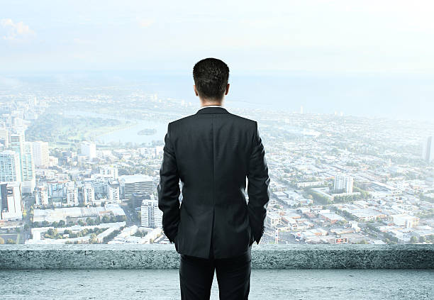 istock businessman standing on roof 179580124