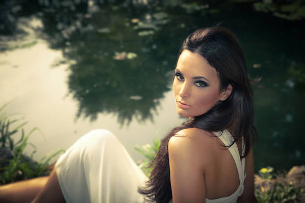 istock woman by the pond 179582153