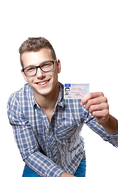 istock Young man showing off his driver license 179582375