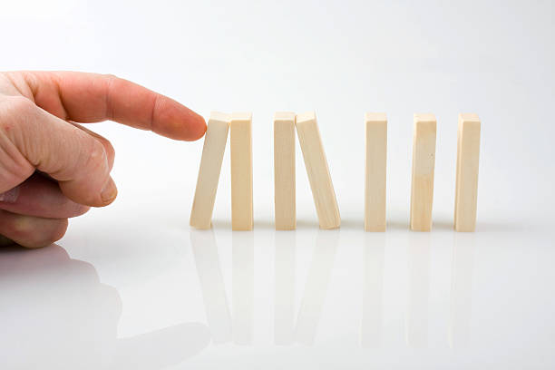 istock stopping the domino effect 179582762