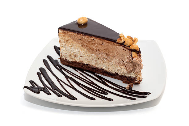 istock Nougat cake with chocolate, hazelnuts and topping isolated 179585855